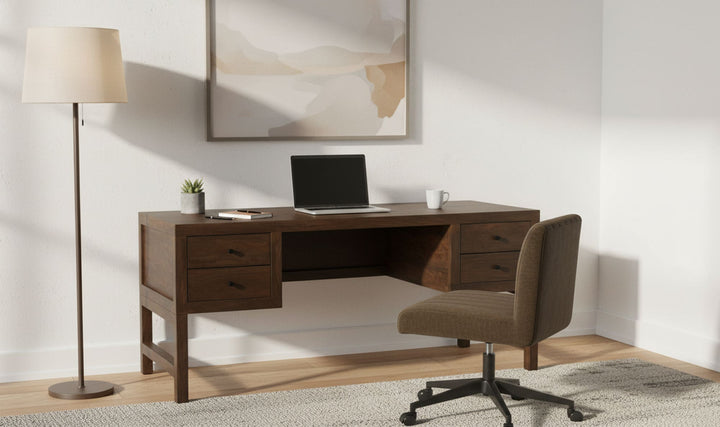 WINDSOR dark brown desk in a furnished workspace